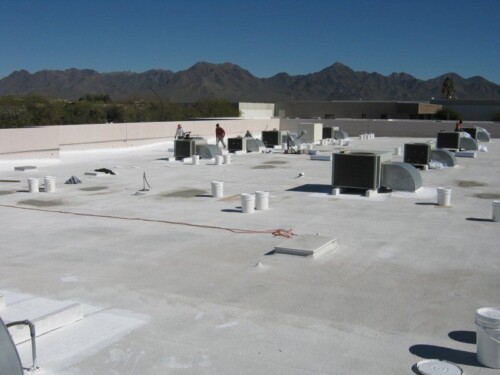 Another flat Commercial roof that has been coated with white elastomeric paint from Sunland Coatings.