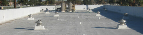 A commercial flat roof after being coated with white elastomeric paint from Sunland Coatings in Phoenix, AZ.